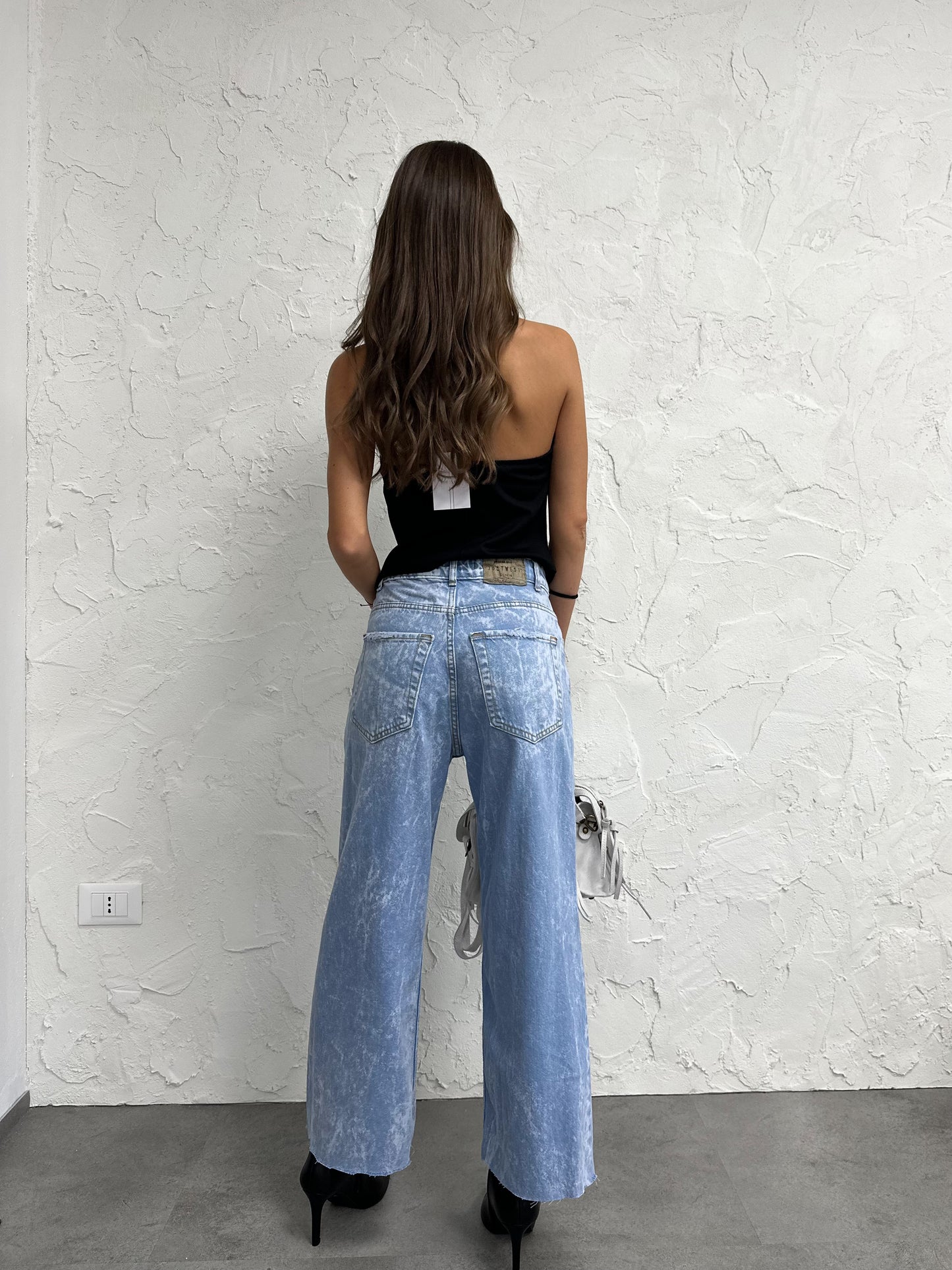Jeans con cinturini
