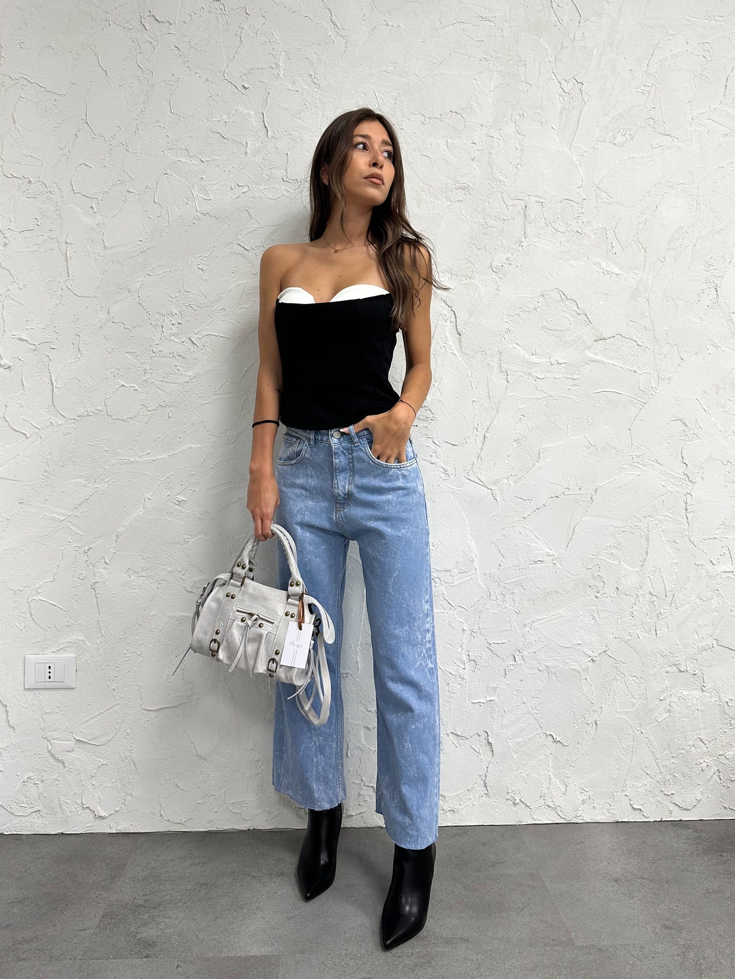 Jeans con cinturini